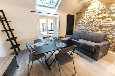 Coin salon dans l'établissement Appartement Place des Vosges, Marais Bastille