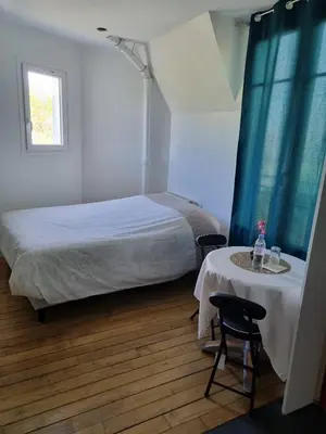 Un ou plusieurs lits dans un hébergement de l'établissement Bohemian cosy flat