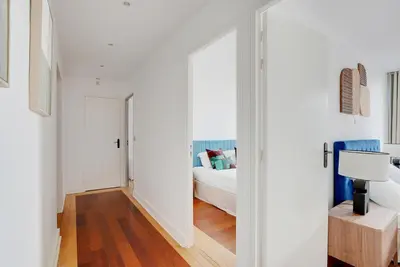 Un ou plusieurs lits dans un hébergement de l'établissement Boutique Appartements Madeleine
