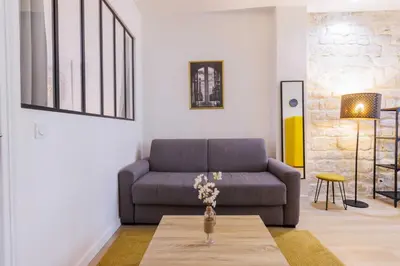 Coin salon dans l'établissement Loft Épuré et Confortable - 6 Pers Voltaire - 11e