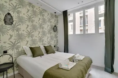 Un ou plusieurs lits dans un hébergement de l'établissement Sublime Paris apartment 3Br-10P