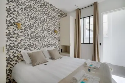 Un ou plusieurs lits dans un hébergement de l'établissement Sublime Paris apartment 3Br-10P