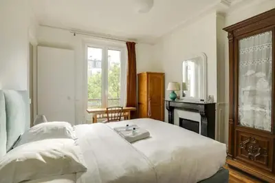 Un ou plusieurs lits dans un hébergement de l'établissement Bel appartement parisien - Les Gobelins