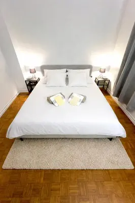 Un ou plusieurs lits dans un hébergement de l'établissement Magnifique appartement Paris 11ème