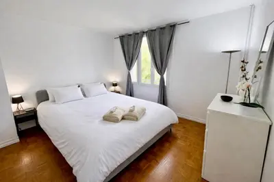 Un ou plusieurs lits dans un hébergement de l'établissement Magnifique appartement Paris 11ème