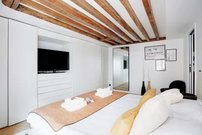 Un ou plusieurs lits dans un hébergement de l'établissement Cozy apartment - 1BR-4P - Les Halles