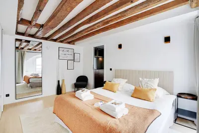 Un ou plusieurs lits dans un hébergement de l'établissement Cozy apartment - 1BR-4P - Les Halles