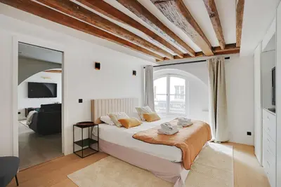 Un ou plusieurs lits dans un hébergement de l'établissement Cozy apartment - 1BR-4P - Les Halles