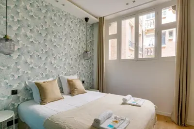 Un ou plusieurs lits dans un hébergement de l'établissement Sublime appartement Paris 4Br-12P