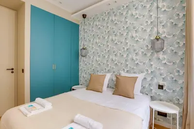 Un ou plusieurs lits dans un hébergement de l'établissement Sublime appartement Paris 4Br-12P
