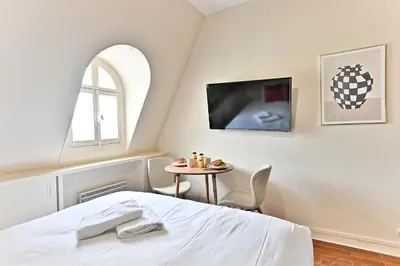 Un ou plusieurs lits dans un hébergement de l'établissement Studio central Opéra Garnier -Paris - II