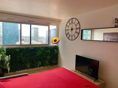 Un ou plusieurs lits dans un hébergement de l'établissement Amazing Studio Paris La Défense