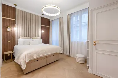 Un ou plusieurs lits dans un hébergement de l'établissement Charming Pied-à-Terre Champs-Élysée