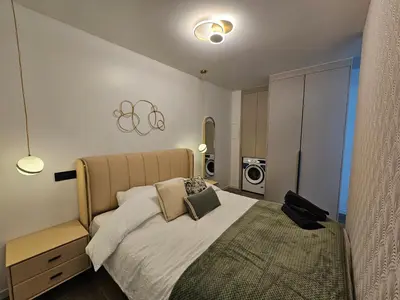 Un ou plusieurs lits dans un hébergement de l'établissement apt cosy proche arena bercy
