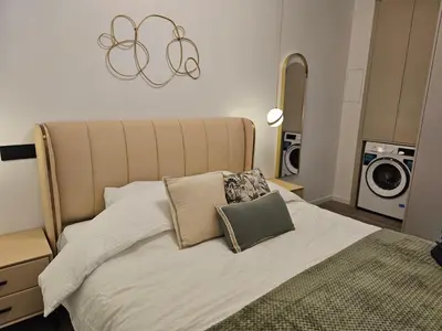Un ou plusieurs lits dans un hébergement de l'établissement apt cosy proche arena bercy
