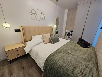 Un ou plusieurs lits dans un hébergement de l'établissement apt cosy proche arena bercy