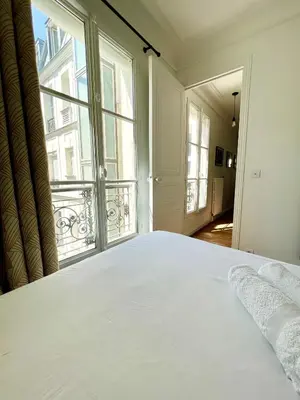 Un ou plusieurs lits dans un hébergement de l'établissement Appartement de charme - Place Victor Hugo - Paris 16e