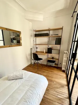 Un ou plusieurs lits dans un hébergement de l'établissement Appartement de charme - Place Victor Hugo - Paris 16e