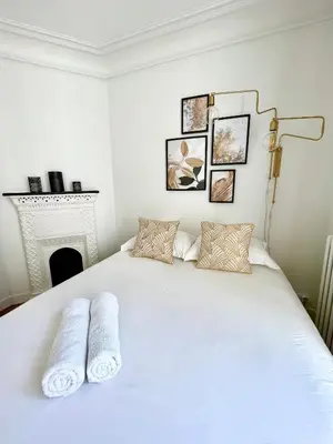 Un ou plusieurs lits dans un hébergement de l'établissement Appartement de charme - Place Victor Hugo - Paris 16e