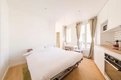 Un ou plusieurs lits dans un hébergement de l'établissement Magic Apartment 4p Sacre Coeur