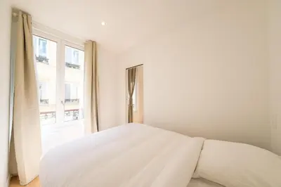 Un ou plusieurs lits dans un hébergement de l'établissement Magic Apartment 4p Sacre Coeur