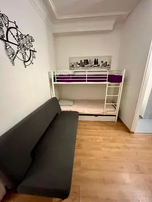 Un ou plusieurs lits dans un hébergement de l'établissement Cosy 2 rooms Montmartre - Eugène Suë