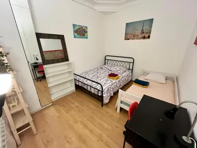 Un ou plusieurs lits dans un hébergement de l'établissement Cosy 2 rooms Montmartre - Eugène Suë