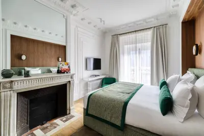 Un ou plusieurs lits dans un hébergement de l'établissement Oniri - Serviced Apartments in Louvre - Rue de Rivoli