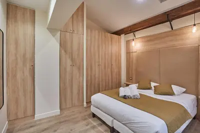 Un ou plusieurs lits dans un hébergement de l'établissement Sublime apartment in the heart of Paris 10 people FBMAR5
