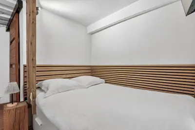 Un ou plusieurs lits dans un hébergement de l'établissement Studio Herold - Place de Victoires by B'Your Home
