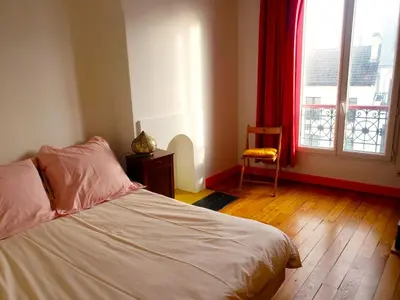 Un ou plusieurs lits dans un hébergement de l'établissement Un petit coin de soleil chez l'habitant