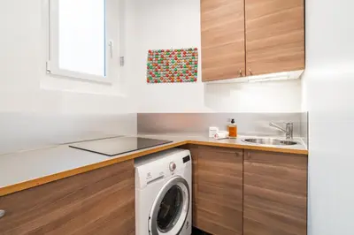 Cuisine ou kitchenette dans l'établissement Appartement cosy à 2 min de Paris 16 ème