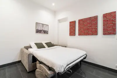 Un ou plusieurs lits dans un hébergement de l'établissement Appartement cosy à 2 min de Paris 16 ème