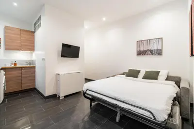 Un ou plusieurs lits dans un hébergement de l'établissement Appartement cosy à 2 min de Paris 16 ème