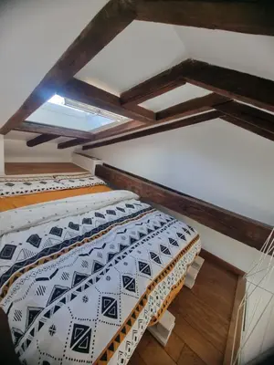 Un ou plusieurs lits dans un hébergement de l'établissement Un appartement charmant à deux pas de Paris !