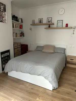 Un ou plusieurs lits dans un hébergement de l'établissement Cozy Appartment in Voltaire