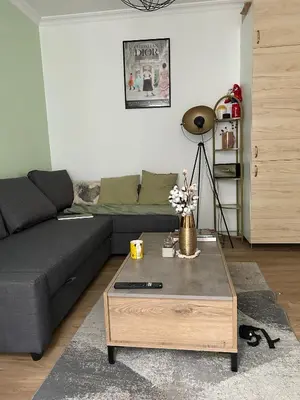 Coin salon dans l'établissement Cozy Appartment in Voltaire