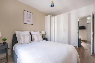 Un ou plusieurs lits dans un hébergement de l'établissement Appartement Cozy à Paris