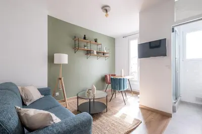 Coin salon dans l'établissement Appartement Cozy à Paris