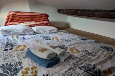 Un ou plusieurs lits dans un hébergement de l'établissement Charming studio for two in the 10th