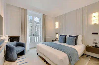 Un ou plusieurs lits dans un hébergement de l'établissement TheLander - Serviced Apartments in Saint Germain des Prés
