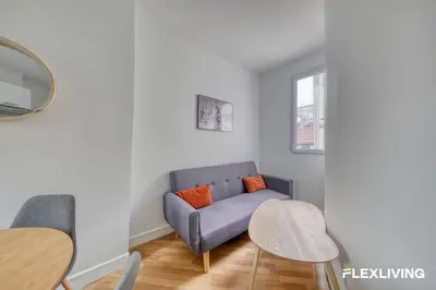 Coin salon dans l'établissement One bedroom Elegant & Central - Opera Montmartre Lafayette