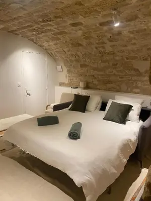 Un ou plusieurs lits dans un hébergement de l'établissement Appartement Triplex à Saint-Germain-des-Prés