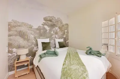 Un ou plusieurs lits dans un hébergement de l'établissement Appartement Triplex à Saint-Germain-des-Prés