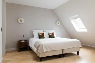 Un ou plusieurs lits dans un hébergement de l'établissement HIGHSTAY - Luxury Serviced Apartments - Arc de Triomphe