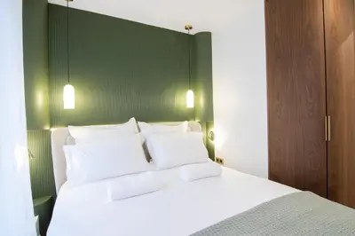 Un ou plusieurs lits dans un hébergement de l'établissement Appartement élégant près de Bastille-Gare de Lyon