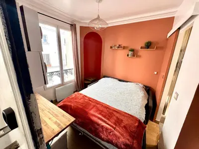 Un ou plusieurs lits dans un hébergement de l'établissement HSH - Studio lumineux en plein coeur de Paris