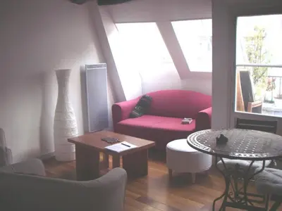 Coin salon dans l'établissement Appartement dans le Marais avec terrasse