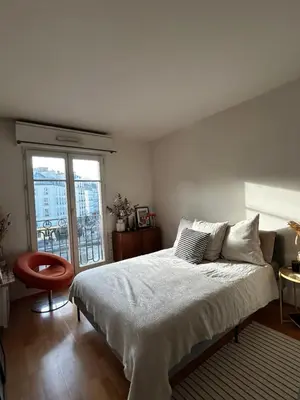 Un ou plusieurs lits dans un hébergement de l'établissement Appartement spacieux et lumineux - Canal Saint Martin