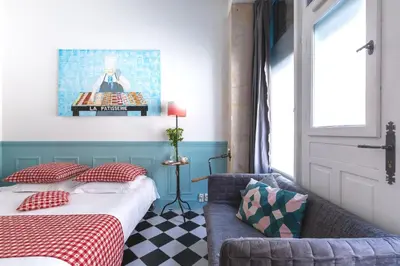 Un ou plusieurs lits dans un hébergement de l'établissement Artisan Lofts Paris close Eiffel Tower